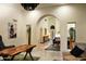 Spacious foyer featuring an arched doorway leading to the dining and living areas at 8332 E San Simon Dr, Scottsdale, AZ 85258