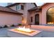 Beautifully lit backyard patio with a fire pit, perfect for cozy evenings outdoors at 10266 E Caron St, Scottsdale, AZ 85258