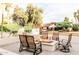 Beautiful backyard patio featuring a modern fire pit, seating, and manicured greenery at 10266 E Caron St, Scottsdale, AZ 85258
