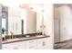 Spacious bathroom featuring double sinks, marble countertops, and ample storage at 10266 E Caron St, Scottsdale, AZ 85258