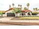 Charming home with a tile roof, manicured lawn, and desert landscaping at 10266 E Caron St, Scottsdale, AZ 85258