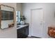 Hallway boasting sleek decor and a modern, decorative mirror above the sink at 10266 E Caron St, Scottsdale, AZ 85258