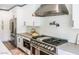 Modern kitchen featuring stainless steel appliances, white cabinets, and updated fixtures at 10266 E Caron St, Scottsdale, AZ 85258