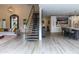 Open-concept living room showcasing natural light and a contemporary staircase at 10266 E Caron St, Scottsdale, AZ 85258