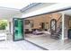 Living room with an open floor plan, seamless indoor-outdoor living with a large folding glass door at 10266 E Caron St, Scottsdale, AZ 85258