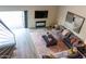 Living room showcasing an open floor plan, stylish decor, fireplace, and outdoor access at 10266 E Caron St, Scottsdale, AZ 85258
