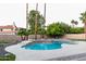 Relaxing pool with palm trees, lounge chairs, and landscaped areas at 10266 E Caron St, Scottsdale, AZ 85258