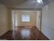 Bright living room with wood floors, large window and a ceiling fan at 10330 W Thunderbird Blvd # C-228, Sun City, AZ 85351