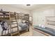 Bedroom featuring a bunk bed plus a single bed and sliding door closet at 10775 N 101St St, Scottsdale, AZ 85260