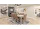 Elegant dining room with a gray brick fireplace, modern decor, and ample seating at 10775 N 101St St, Scottsdale, AZ 85260