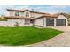 Charming stucco home featuring a lush lawn, tiled roof, and inviting front porch at 10775 N 101St St, Scottsdale, AZ 85260