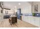 Spacious modern kitchen with white and blue cabinets, stainless steel appliances, and stylish island at 10775 N 101St St, Scottsdale, AZ 85260