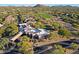 Aerial view of a building with golf course and neighborhood in the distance at 32868 N 69Th St, Scottsdale, AZ 85266