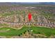 Panoramic aerial view of golf course community shows home's proximity to green spaces and mountain views at 32868 N 69Th St, Scottsdale, AZ 85266