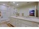 Bright bathroom features a large vanity with dual sinks, a tiled shower, and modern fixtures at 32868 N 69Th St, Scottsdale, AZ 85266