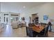 Combined living and dining area offers an open floor plan with golf course view at 32868 N 69Th St, Scottsdale, AZ 85266