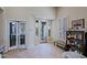 Entryway with wood floors, views through many windows, and access to an office and living area at 32868 N 69Th St, Scottsdale, AZ 85266