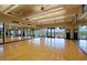 Bright fitness studio with hardwood floors, mirrored walls, and natural light from the surrounding views at 32868 N 69Th St, Scottsdale, AZ 85266