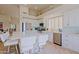 Spacious kitchen with white cabinetry, stainless steel appliances, and an island with seating at 32868 N 69Th St, Scottsdale, AZ 85266