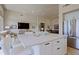 Open floor plan integrating kitchen island, dining area, and living room in a bright space at 32868 N 69Th St, Scottsdale, AZ 85266