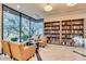 Cozy library with floor-to-ceiling bookshelves and comfortable seating at 32868 N 69Th St, Scottsdale, AZ 85266