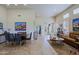 Bright living room and dining area with tile floors, lots of light, and desert artwork at 32868 N 69Th St, Scottsdale, AZ 85266