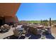 Inviting outdoor patio area with comfortable seating and scenic golf course views at 32868 N 69Th St, Scottsdale, AZ 85266