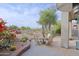 Outdoor patio with comfortable seating, colorful flowers, and golf course vista at 32868 N 69Th St, Scottsdale, AZ 85266