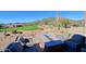 Relaxing outdoor patio with a fire pit, plush seating, and tranquil desert views at 32868 N 69Th St, Scottsdale, AZ 85266