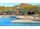 Resort-style pool area with comfortable seating, umbrellas, and scenic desert landscaping at 32868 N 69Th St, Scottsdale, AZ 85266