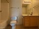 Cozy bathroom featuring a bathtub and a vanity with wooden cabinets at 5757 W Eugie Ave # 1038, Glendale, AZ 85304
