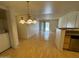 Open floor plan with a view of the living room and backyard beyond the sliding glass doors at 5757 W Eugie Ave # 1038, Glendale, AZ 85304