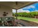 Inviting back patio with comfortable seating, a ceiling fan, and views of the well-maintained backyard at 6726 N 11Th St, Phoenix, AZ 85014