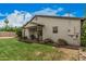 Spacious backyard featuring a covered patio, a grill, and lush greenery, ideal for outdoor living at 6726 N 11Th St, Phoenix, AZ 85014