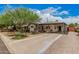 Inviting home showcasing a covered carport, lush greenery, and a well-maintained front yard at 6726 N 11Th St, Phoenix, AZ 85014