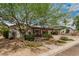 Welcoming home boasting a covered carport, shade tree, and beautifully landscaped front yard at 6726 N 11Th St, Phoenix, AZ 85014