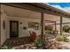 Charming front porch with comfortable seating, inviting decor, and views of the lush surroundings at 6726 N 11Th St, Phoenix, AZ 85014