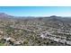 Beautiful aerial view of a community nestled among desert vegetation and mountain peaks at 6887 E Hacienda La Colorada Dr, Gold Canyon, AZ 85118