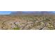 Expansive aerial view of a desert community nestled against a mountain range at 6887 E Hacienda La Colorada Dr, Gold Canyon, AZ 85118