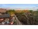 Aerial view of a backyard with a covered patio and a BBQ area at 6887 E Hacienda La Colorada Dr, Gold Canyon, AZ 85118