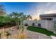 Well landscaped backyard with desert plants, artificial turf and stone accents at 6887 E Hacienda La Colorada Dr, Gold Canyon, AZ 85118
