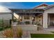 Back patio featuring pergola, outdoor kitchen area, and artificial turf at 6887 E Hacienda La Colorada Dr, Gold Canyon, AZ 85118