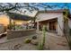 Spacious backyard featuring a pergola-covered patio, grill, and desert landscape at 6887 E Hacienda La Colorada Dr, Gold Canyon, AZ 85118