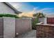Landscaped backyard with block fencing, desert vegetation and mountain views in background at 6887 E Hacienda La Colorada Dr, Gold Canyon, AZ 85118