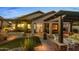 Backyard with built in BBQ area, covered seating and grass at 6887 E Hacienda La Colorada Dr, Gold Canyon, AZ 85118