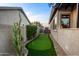 Backyard putting green alongside cacti, shrubbery, and wall at 6887 E Hacienda La Colorada Dr, Gold Canyon, AZ 85118