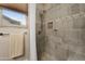 Beautiful bathroom shower featuring neutral tile and pebbled floor at 6887 E Hacienda La Colorada Dr, Gold Canyon, AZ 85118