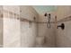 Beautifully tiled shower with built-in niches and a shower seat at 6887 E Hacienda La Colorada Dr, Gold Canyon, AZ 85118