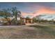 Community gazebo with lighting, seating, and desert landscaping in the evening at 6887 E Hacienda La Colorada Dr, Gold Canyon, AZ 85118