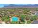 Aerial shot of a community pool with cabanas surrounded by lush landscaping at 6887 E Hacienda La Colorada Dr, Gold Canyon, AZ 85118